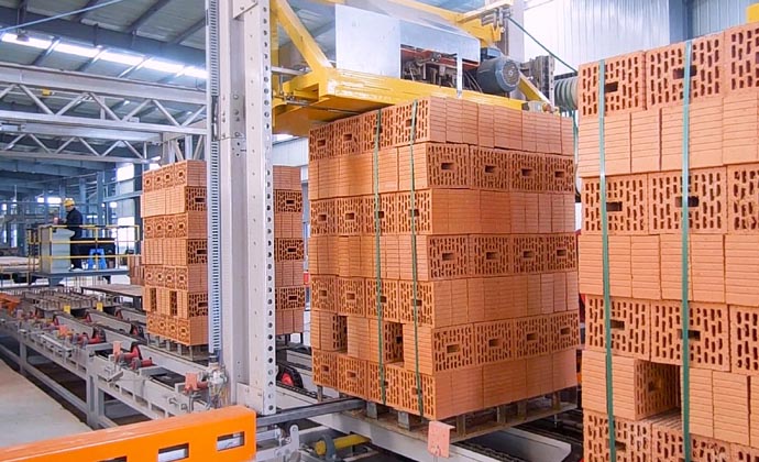 Fully automated brick strapping system